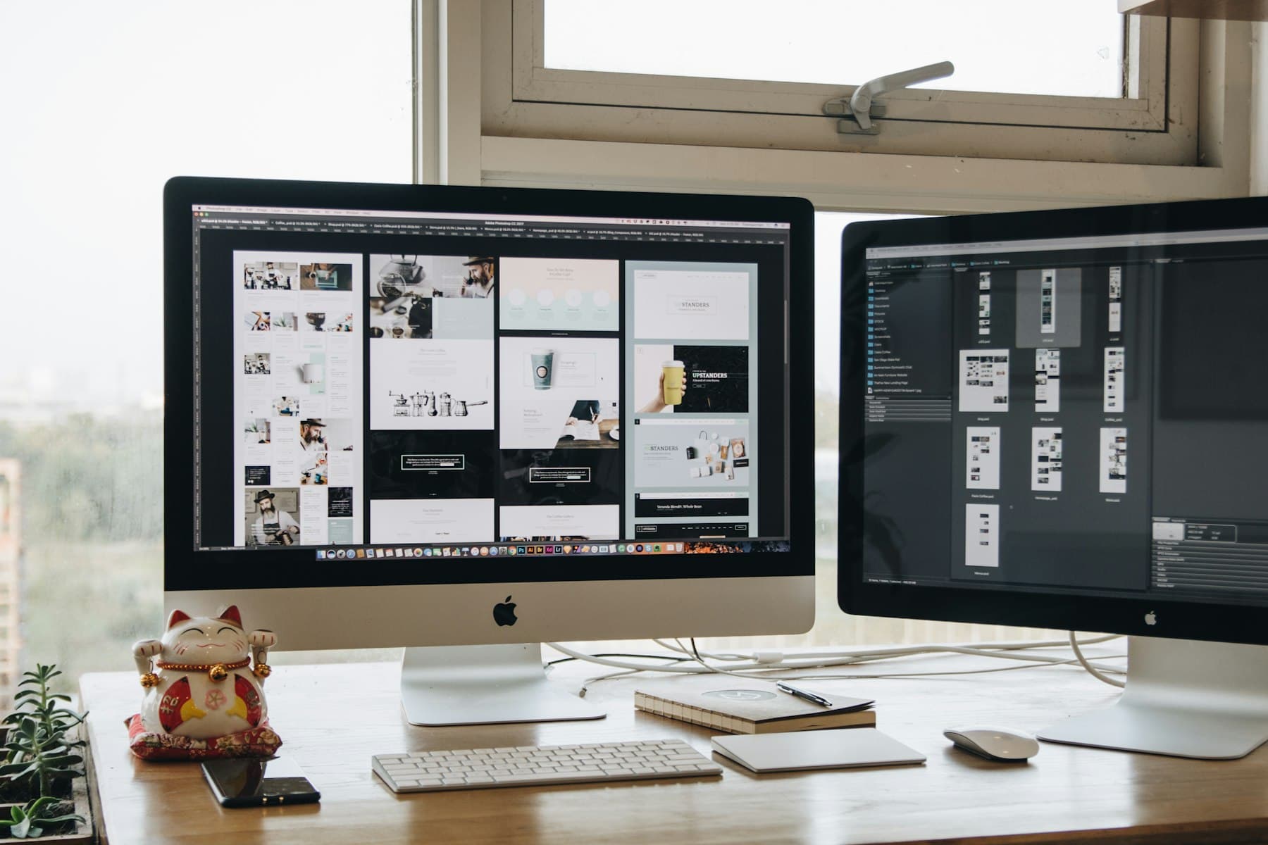 Design work open on two monitors at a desk